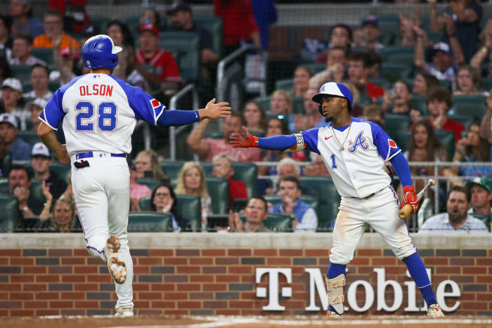 May 6, 2023; Atlanta, Georgia, USA; Atlanta Braves first baseman Matt Olson (28) celebrates after scoring with second baseman Ozzie Albies (1) against the Baltimore Orioles in the fourth inning at Truist Park.